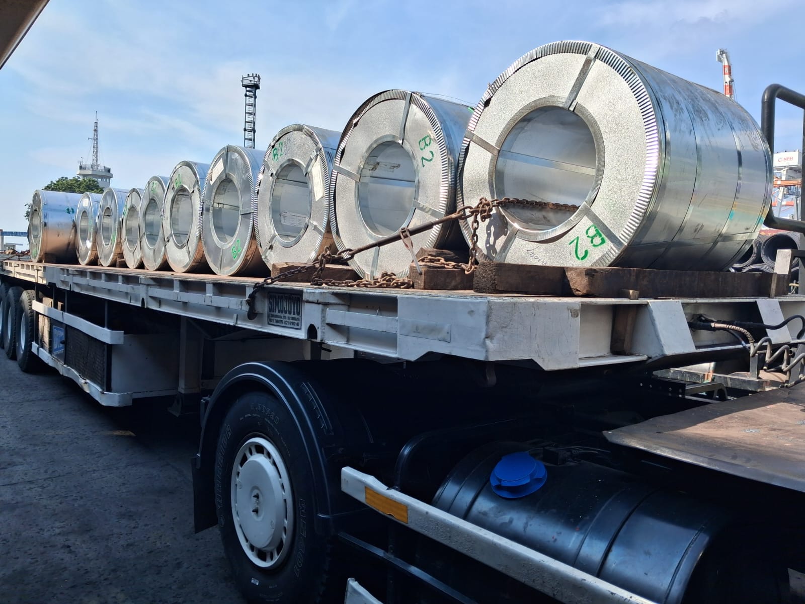 PAL flatbed truck carrying steel coil cargo